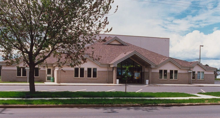 Image of a community centre with a tree in front