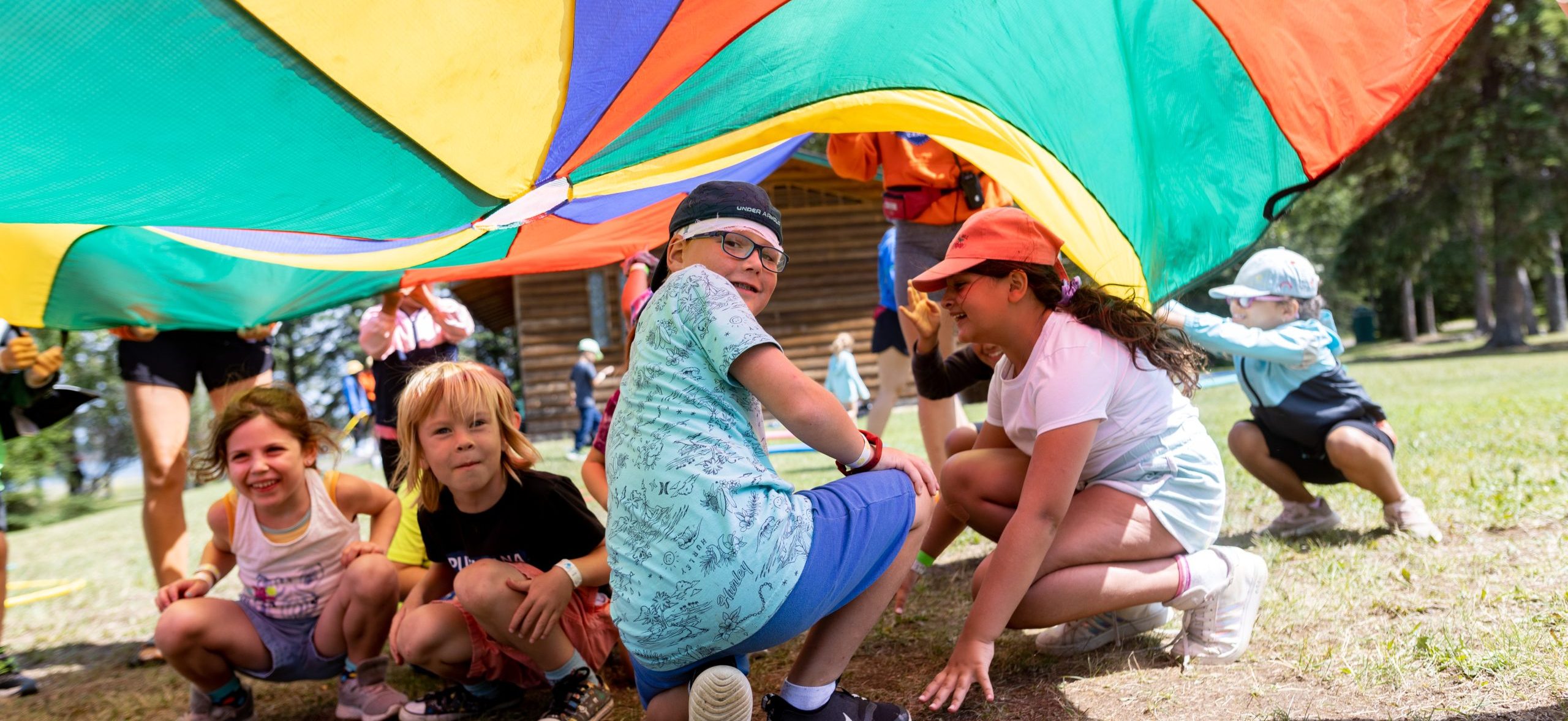 Chippewa participants playing under a parachute.