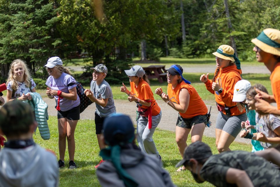 Chippewa Summer Camps staff and participants dancing in the outdoors.