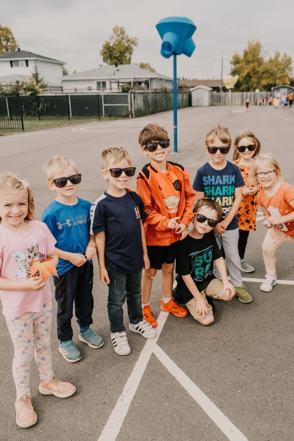 tbcdsb | group of St. Francis students stand, wearing cool sunglasses.