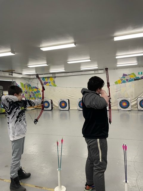 Youth practicing archery